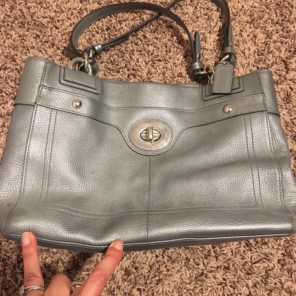 Shiny silver coach purse